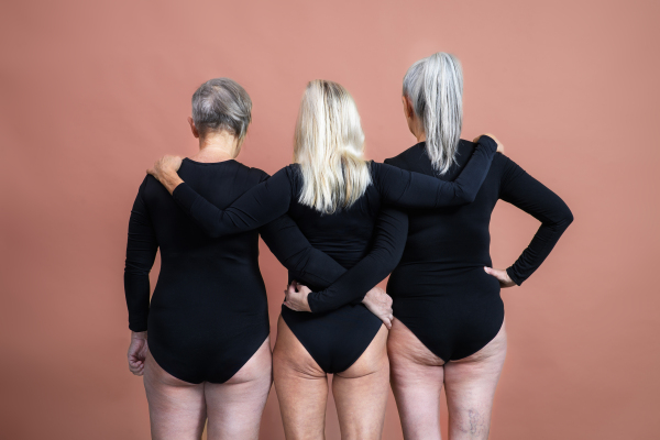 Rear view of three senior friends, body positivity concept.