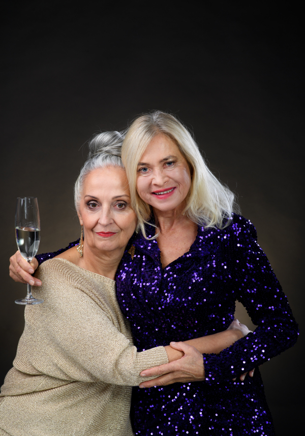 Portrait of happy senior friends with glass of wine, celebration concept.