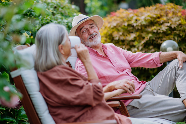 Happy couple relaxing together in the garden.