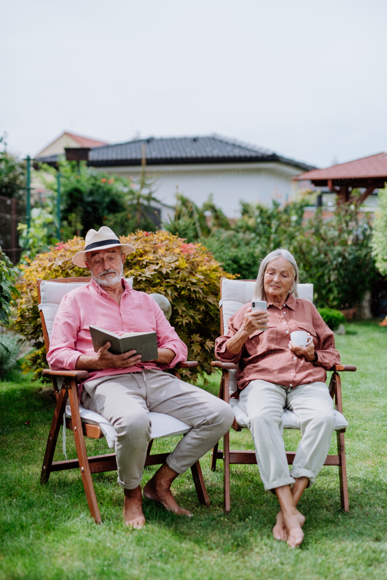 Happy couple relaxing together in the garden.