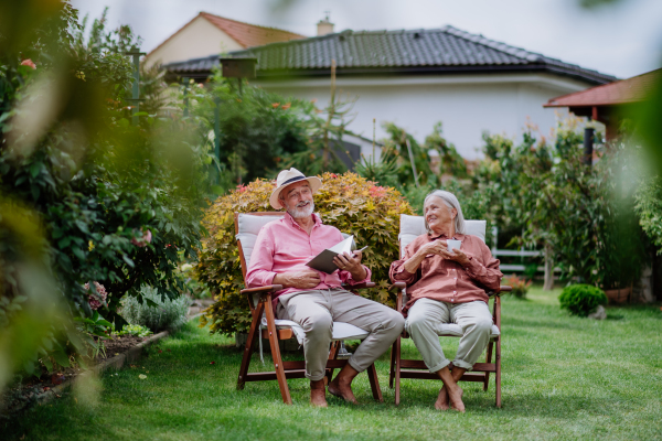 Happy couple relaxing together in the garden.