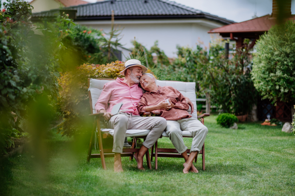 Happy couple relaxing together in the garden.