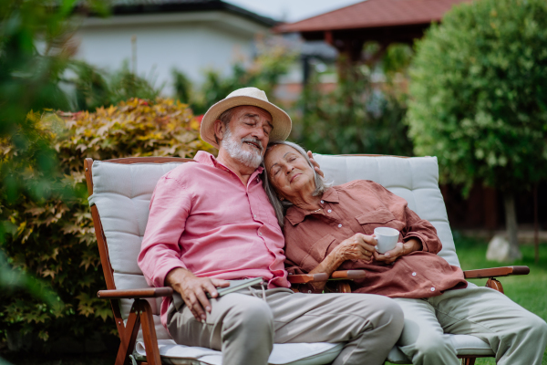 Happy couple relaxing together in the garden.