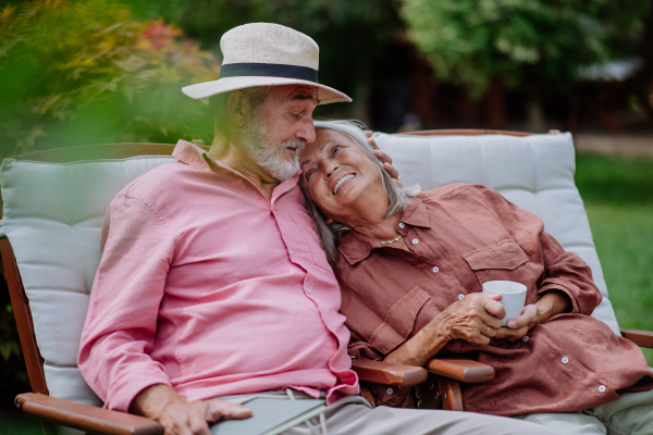 Happy couple relaxing together in the garden.