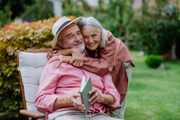 Happy couple relaxing together in the garden.