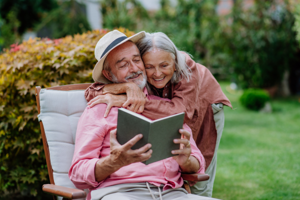 Happy couple relaxing together in the garden.