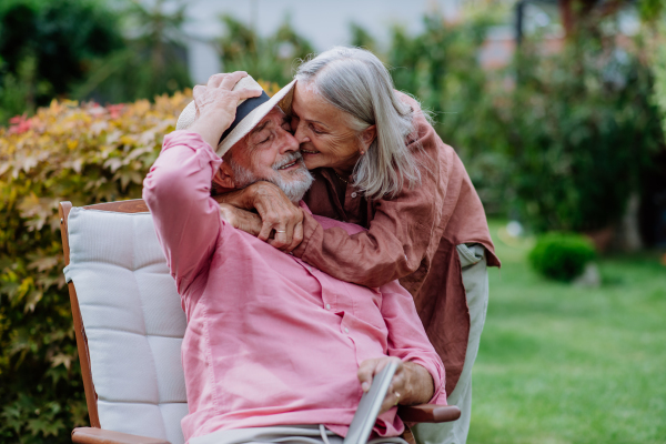 Happy couple relaxing together in the garden.