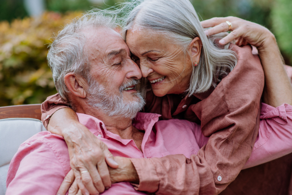 Happy couple relaxing together in the garden.