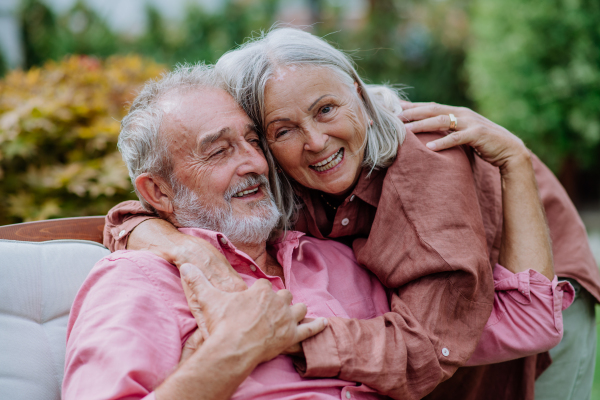 Happy couple relaxing together in the garden.