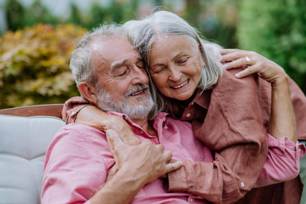 Happy couple relaxing together in the garden.