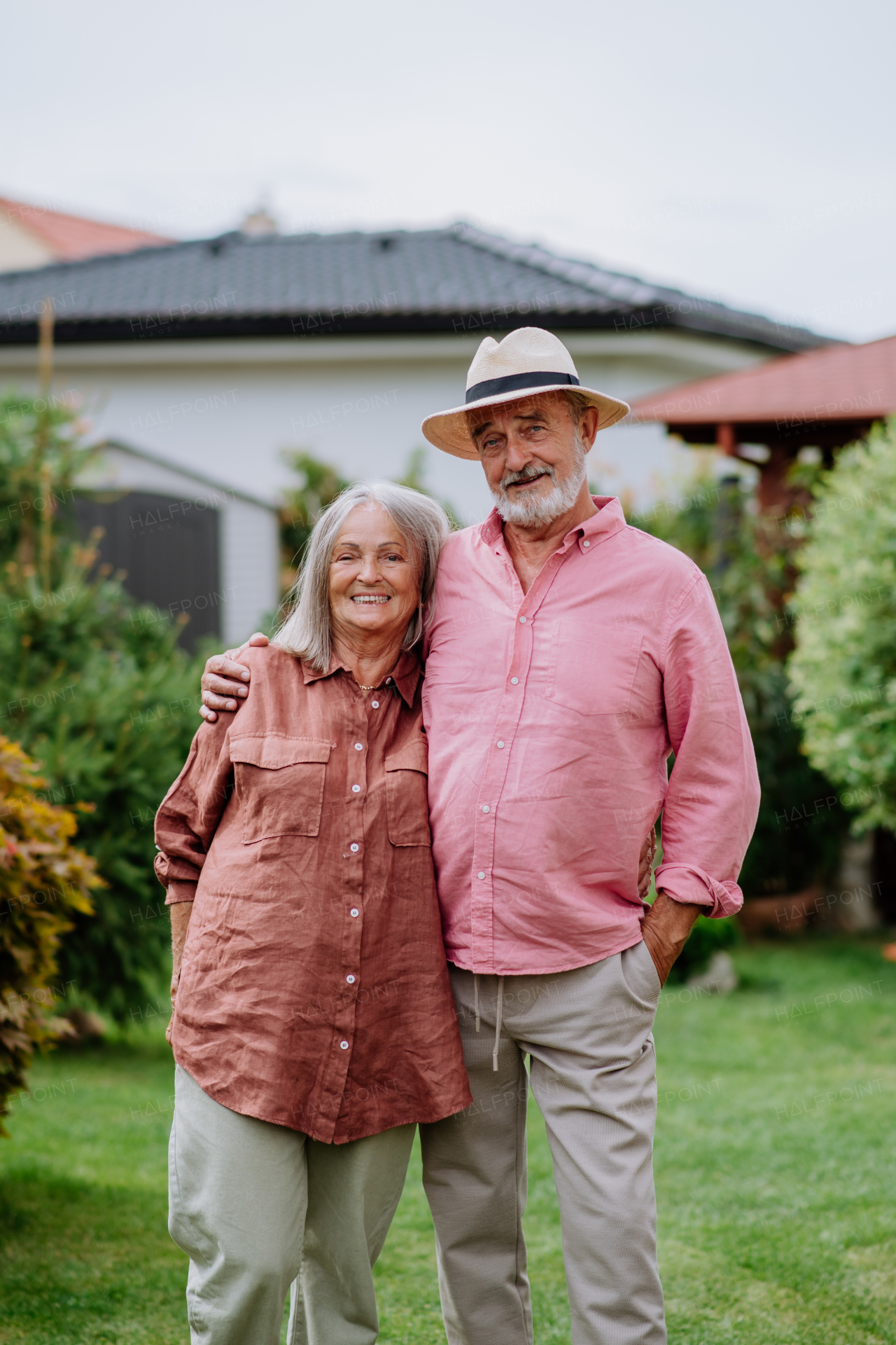 Senior couple in love posing together in a garden.