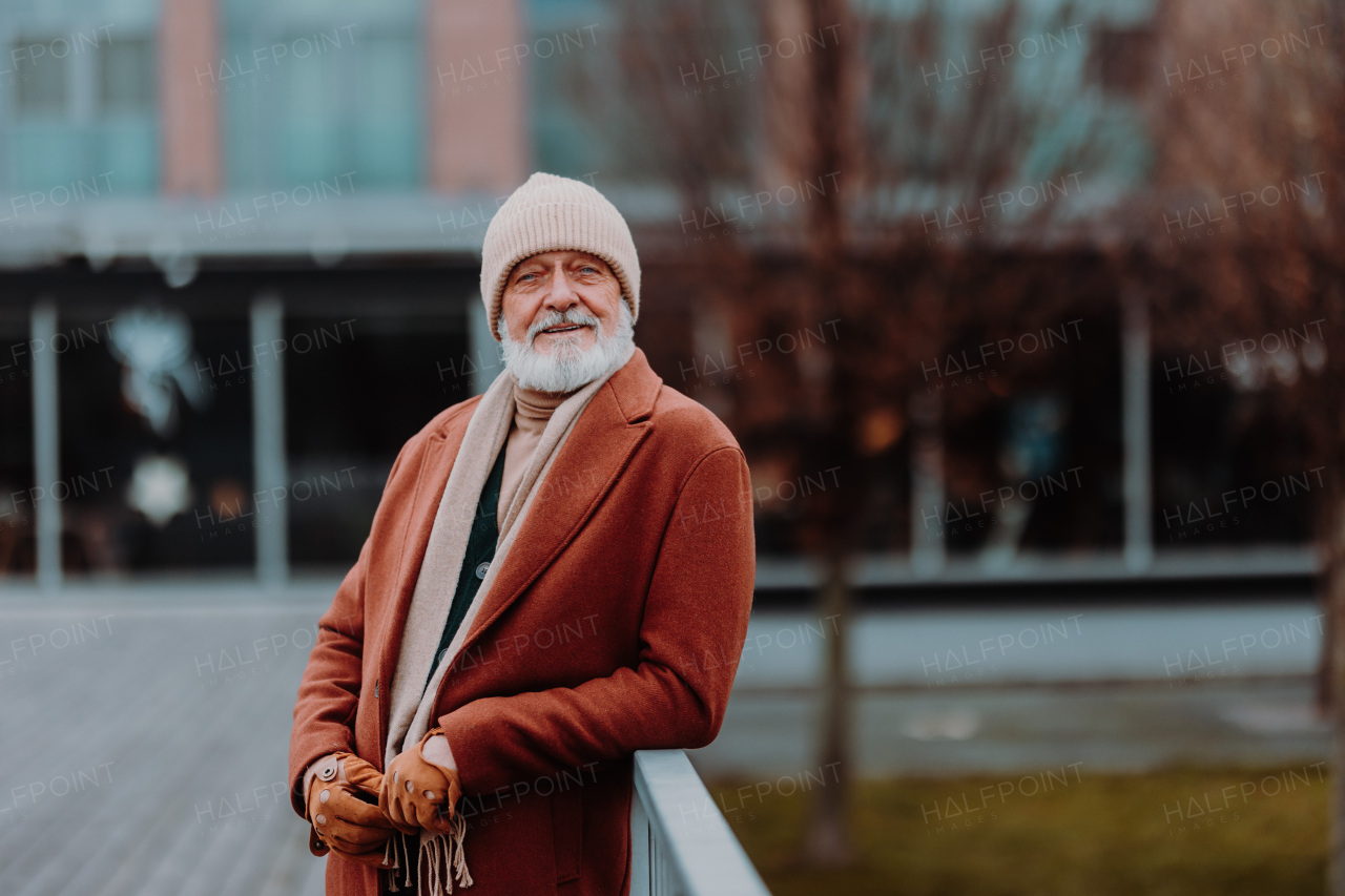 Portrait of elegant senior man in a city.