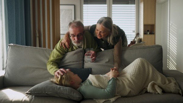 Grandparents taking care of their sick little granddaughter.