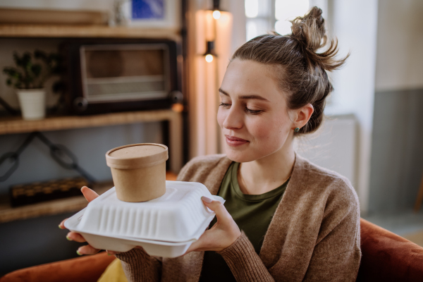 Young woman ordered lunch from a restaurant.