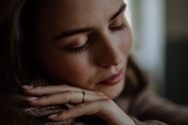 Portrait of an unhappy young woman, concept of mental health.