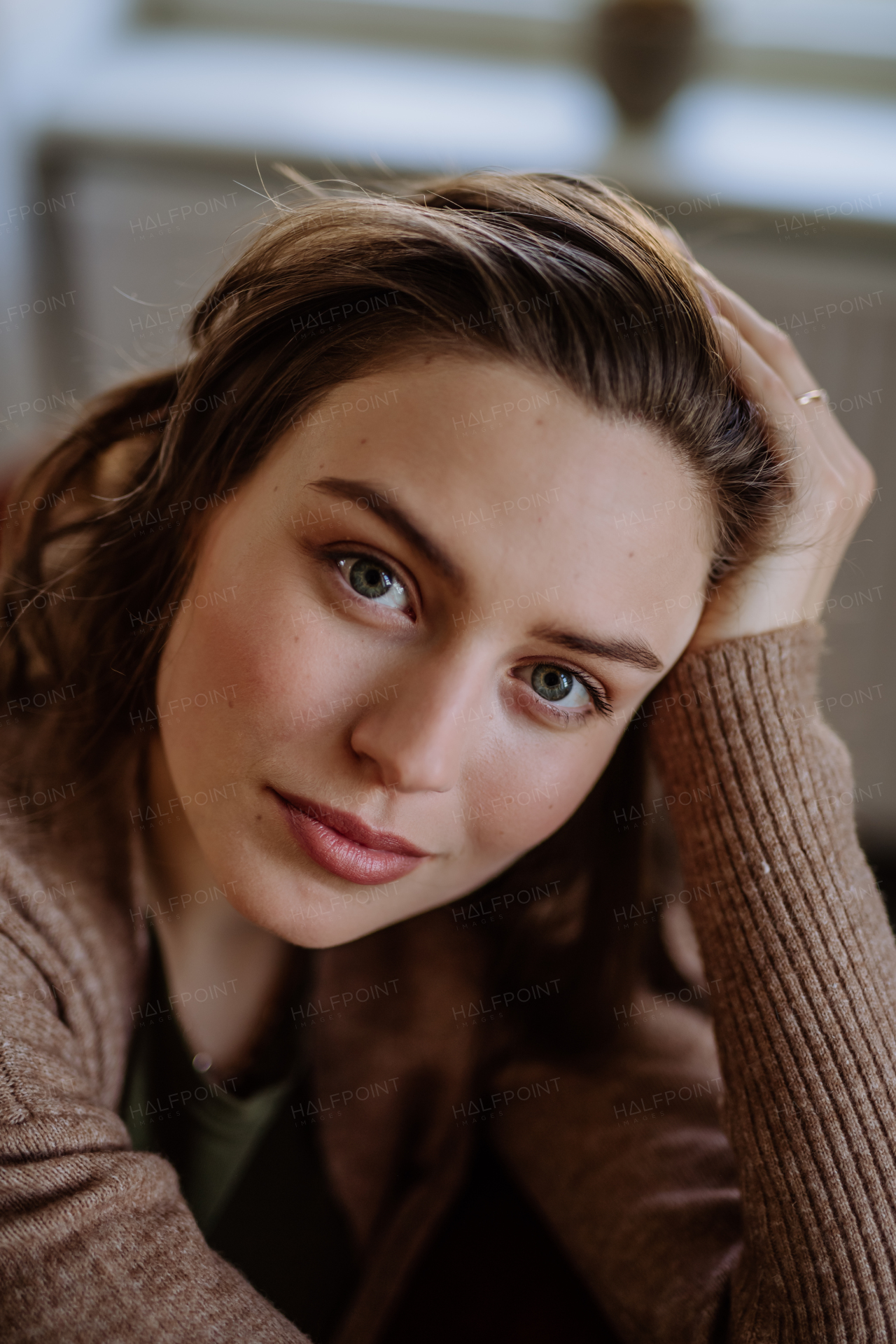 Portrait of a young beautiful woman with natural make-up.