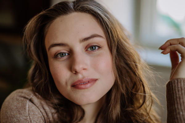 Portrait of a young beautiful woman with natural make-up.