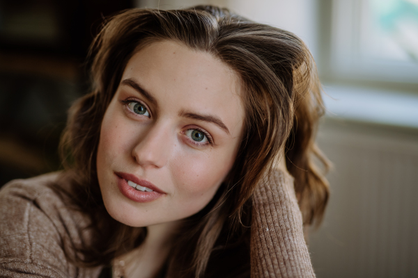 Portrait of a young beautiful woman with natural make-up.