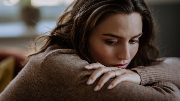 Portrait of an unhappy young woman, concept of mental health.