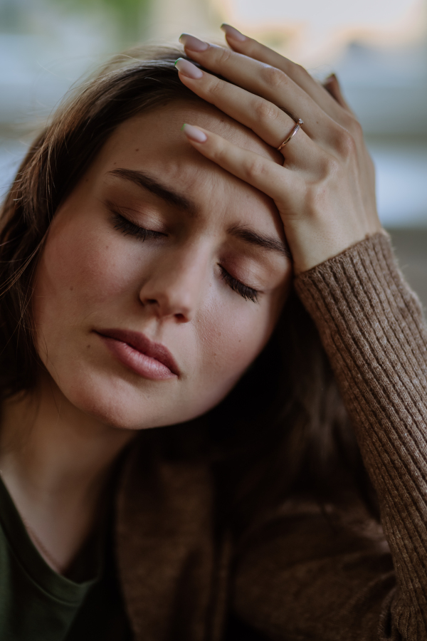 Portrait of an unhappy young woman, concept of mental health.