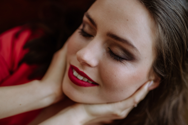 Portrait of an young woman with evening make-up.