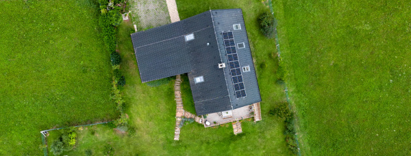 Top view of solar photovoltaic panels on a roof, alternative energy, saving resources and sustainable lifestyle concept.