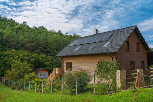 House with solar panels.Alternative energy, saving resources and sustainable lifestyle concept.