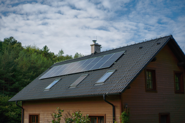 Solar photovoltaic panels on a roof of family house, alternative energy, saving resources and sustainable lifestyle concept.