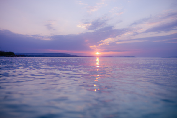 Summer colourful sunset at a sea, tranquil scene.