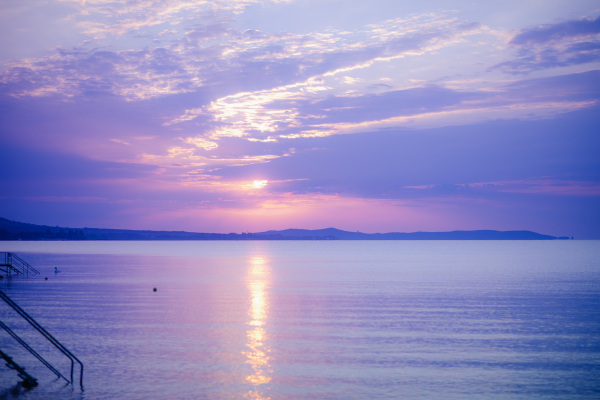 Summer colourful sunset at a sea, tranquil scene.