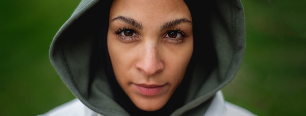 Portrait of a young muslim woman outdoor, wide photography.