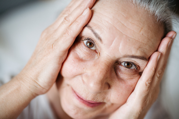 Portrait of senior woman resting in the apartment.