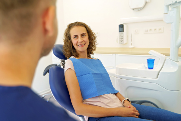 Dentist having consultation with patient in his modern ambulance.