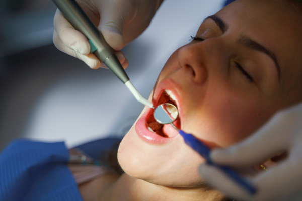 Close-up of young woman at dental examination in an ambulance.