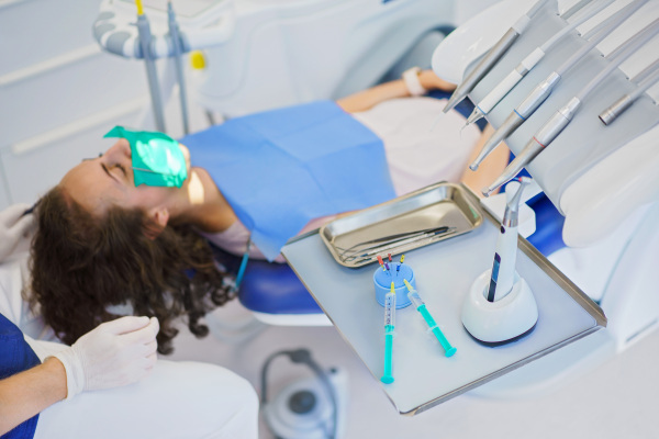 Top view of dental examination in an ambulance.