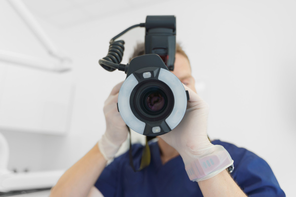 Dentist doing a teeth scan in the private ambulance