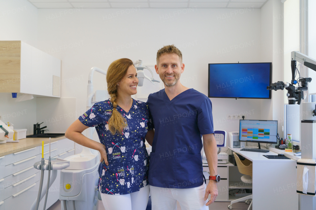 Dentist posing with a nurse in dentists ambulance.