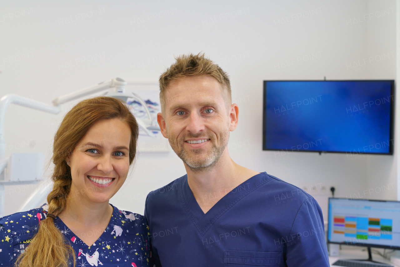 Dentist posing with a nurse in dentists ambulance.