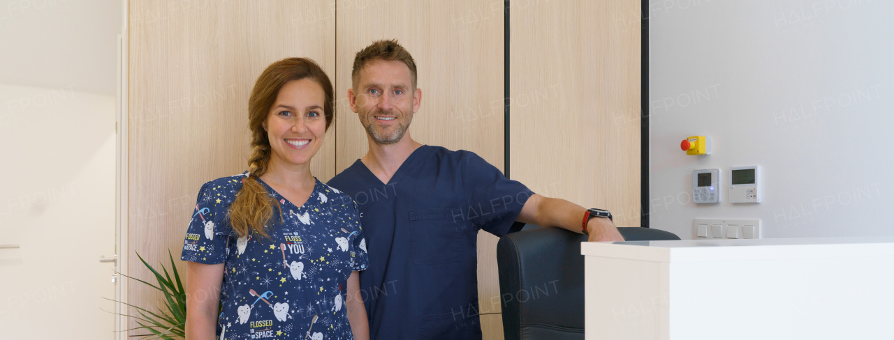 Dentist posing with a nurse in dentists ambulance.