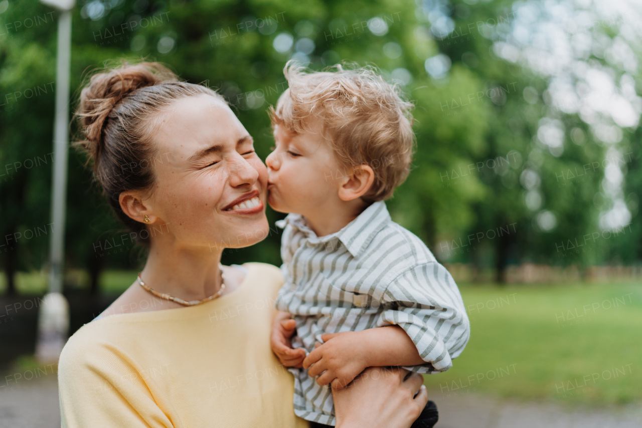 Young mother with little son on a walk after walk.