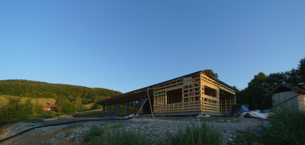 Unfinished construction of ecological sustainable wooden eco house in the middle of nature.