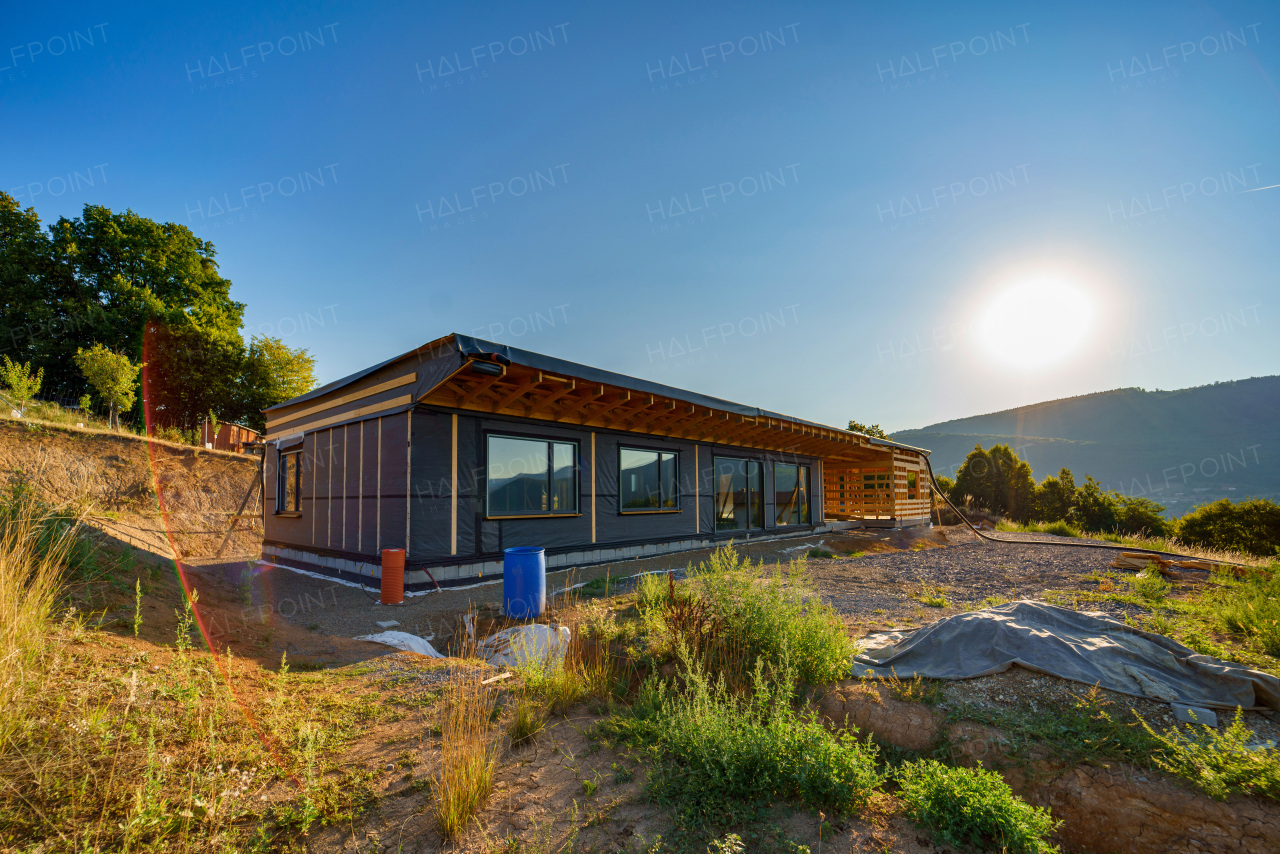 Unfinished construction of ecological sustainable wooden eco house in the middle of nature.