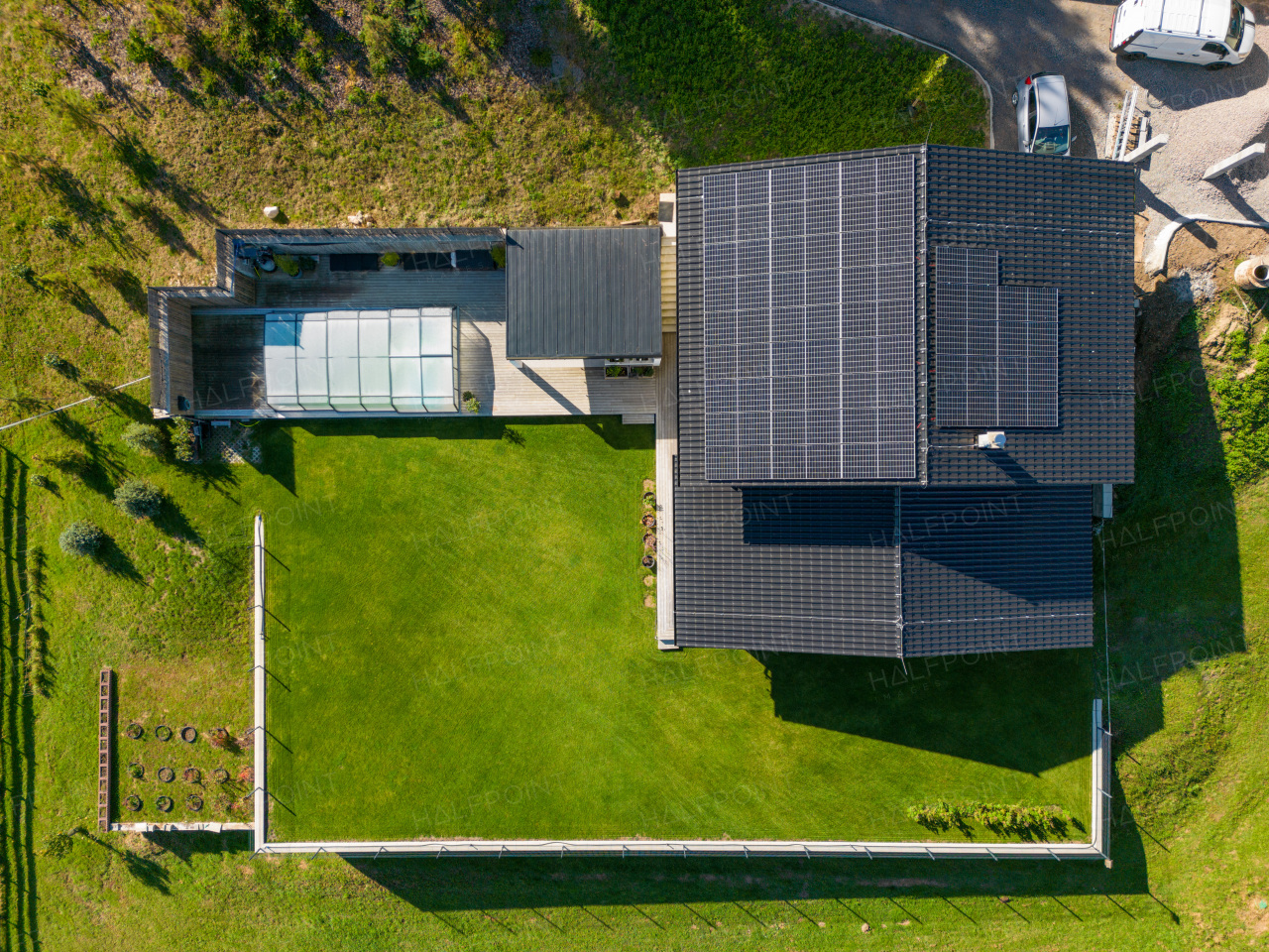 Top view of solar photovoltaic panels on a roof, alternative energy, saving resources and sustainable lifestyle concept.