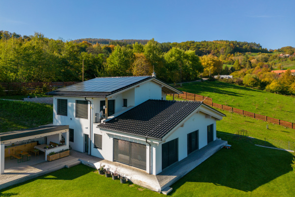 High angle view of solar photovoltaic panels on a roof, alternative energy, saving resources and sustainable lifestyle concept.