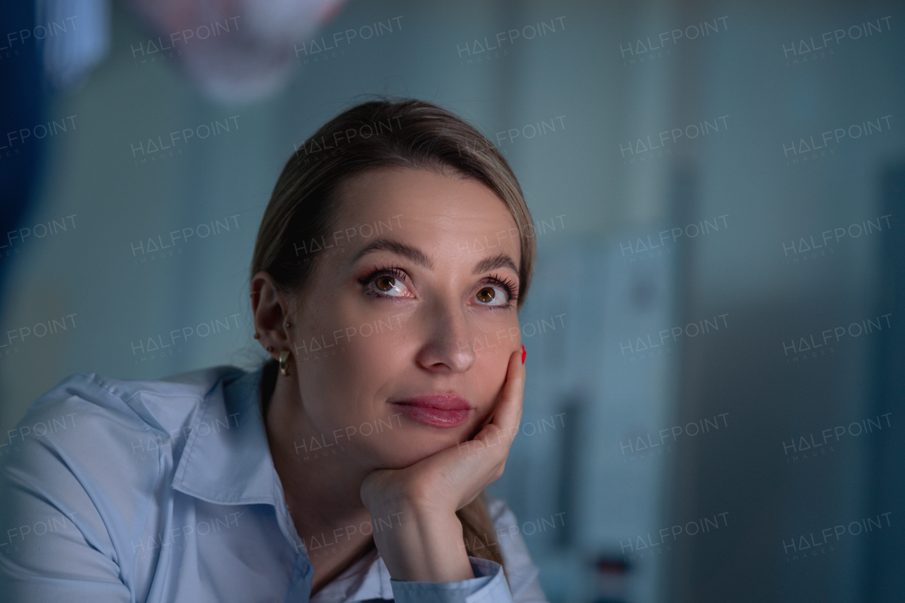 Portrait of beautiful woman, resting, propping head with hand.