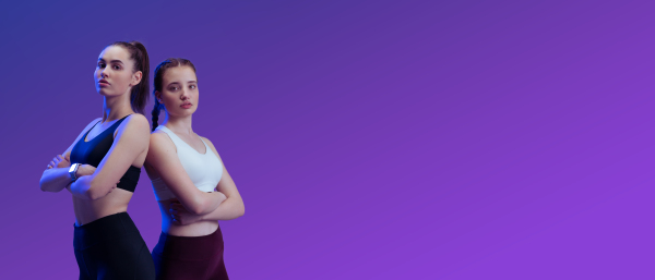 Young beautiful athlete women are posing in a studio, copy space.