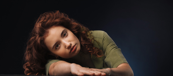 Portrait of young bored girl in a studio.