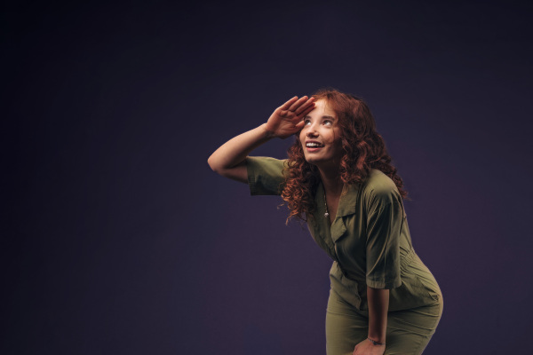 Portrait of a young redhead woman, studio shoot.