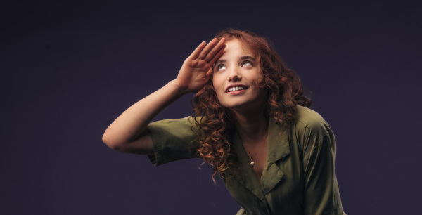 Portrait of a young redhead woman, studio shoot.