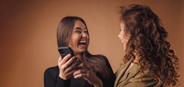 Portrait of two young happy friends, studio shoot,